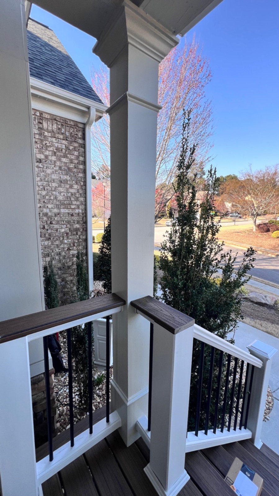 New railings and decking with the neighborhood view restored
